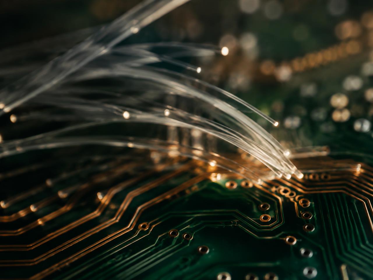 Fiber optic threads over a copper-traced circuit board